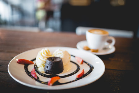 The picture of hot chocolate lava cake with vanilla ice cream and fresh strawberryの写真素材