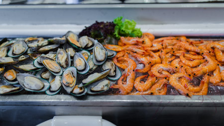 Picture of fresh green mussel and shrimps in seafood on ice buffet bar