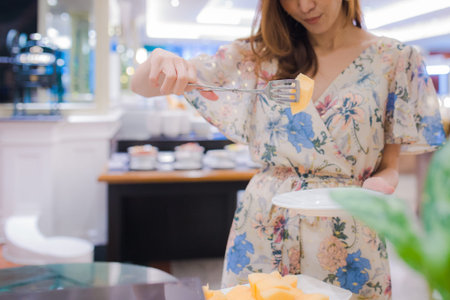 Picture of asian woman is picking cantaloupe. Delicious asian fruit for healthy lifestyleの写真素材
