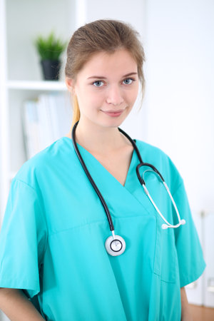 Portrait of young female surgeon doctor in a hospitalの写真素材