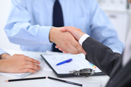 Business people shaking hands, finishing up a meetingの写真素材