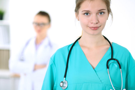 Portrait of young female surgeon doctor in a hospitalの写真素材