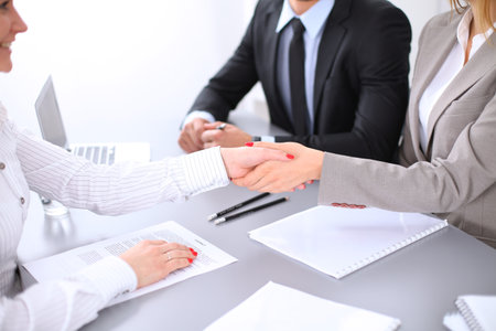 Business people shaking hands, finishing up a meeting. Copy space  at the left cornerの写真素材