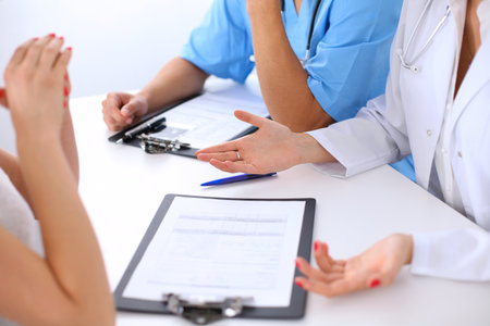 Doctor and patient are discussing somethingの写真素材