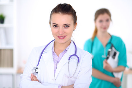 Portrait of young female  doctor in a hospitalの写真素材