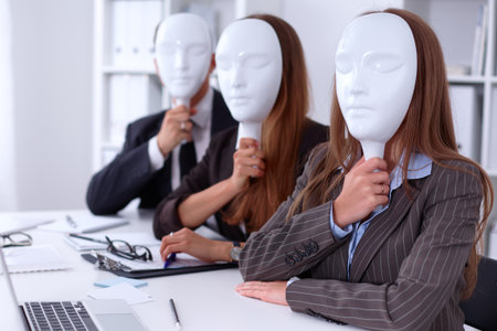 Group of business people  at meeting. Business people hide their emotions under the mask of confidence during the negotiations , business conceptの写真素材
