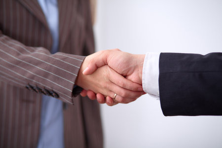 Business people shaking hands, standingの写真素材