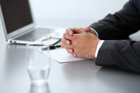 Close-up of male hands with pen over document,  business conceptの写真素材