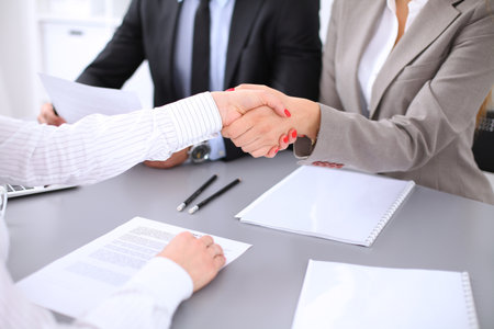 Business people shaking hands, finishing up a meeting. Copy space  at the left cornerの写真素材