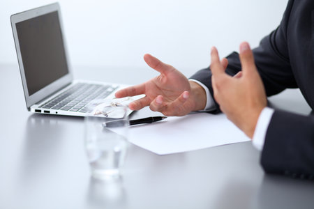 Close-up of male hands with pen over document,  business conceptの写真素材