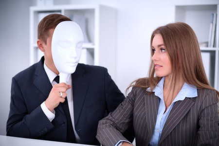 A group of business people at a meeting . They do not hear me, they dont want to understand me, business conceptの写真素材