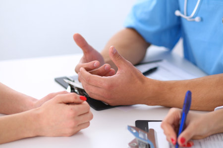 Doctor and patient are discussing somethingの写真素材