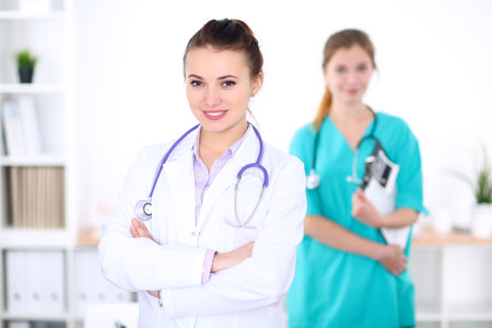 Portrait of young female  doctor in a hospitalの写真素材