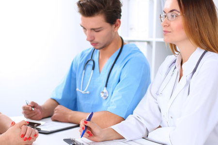 Doctor and patient are discussing somethingの写真素材