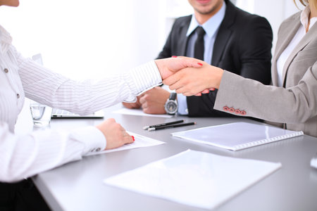 Business people shaking hands, finishing up a meeting. Copy space  at the left cornerの写真素材