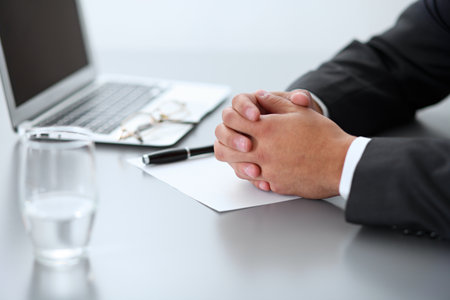 Close-up of male hands with pen over document,  business conceptの写真素材