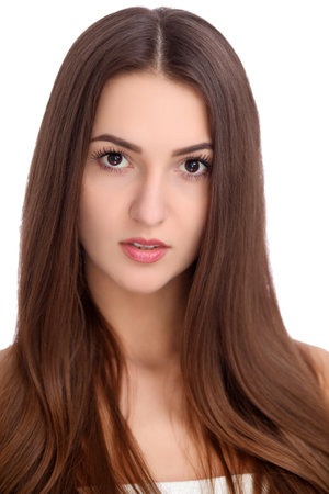 Young beautiful brunette woman face portrait with healthy skinの写真素材