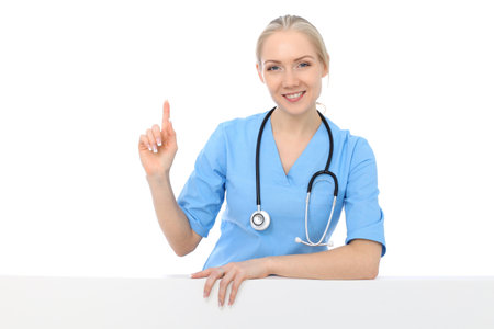 Smiling young nurse portrait isolated over white background. Advertising in medicine and health careの写真素材