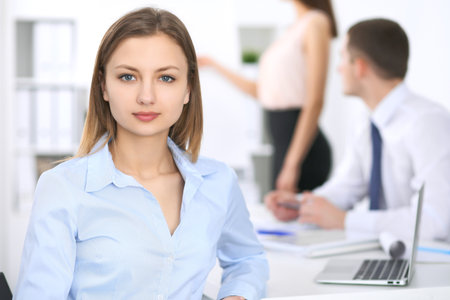 Portrait of a young business woman  at meetingの写真素材