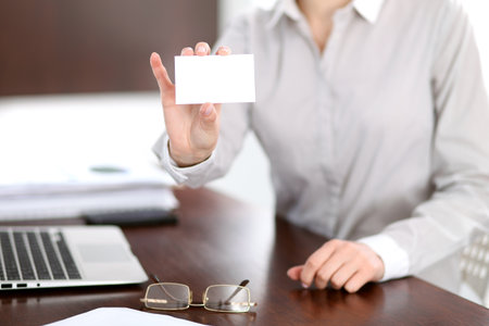 Business woman giving visit cardの写真素材