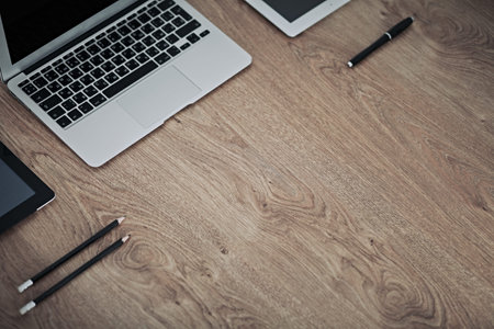 Office workplace with a laptop and documentsの写真素材