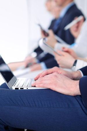 Close-up of business man hands typing on laptop computer at the conference.の写真素材