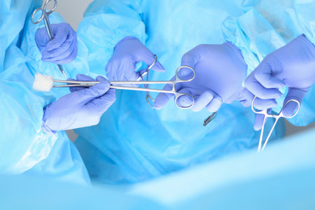 Close-up of unknown surgeons at work while operating at hospital. Health care and veterinary concept.の写真素材