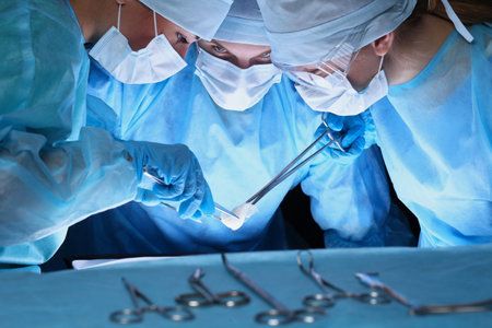 Group of surgeons in masks performing operation. Medicine, surgery and emergency help concepts