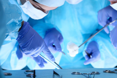 Group of surgeons at work while operating at hospital. Health care and veterinary concept