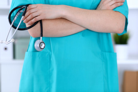 Unknown female doctor holds stethoscope closeup. Physician ready to examine and help patient. Medical help and insurance in health care, best treatment and medicine conceptの写真素材
