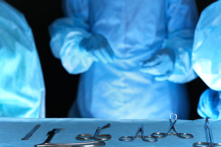 Closeup of surgeons performing operation. Focus on  professional tools. Medicine, surgery and...