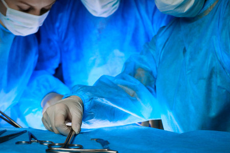 Group of surgeons in masks performing operation. Medicine, surgery and emergency help concepts