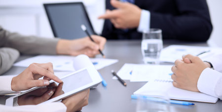 Business people group working together in office, close-up. Meeting and communication conceptの写真素材