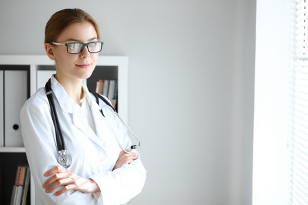 Doctor woman at work. Portrait of female physician at hospital office. Medicine and healthcare conceptの写真素材
