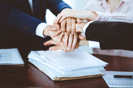 Business people group joining hands. Teamwork or meeting concepts