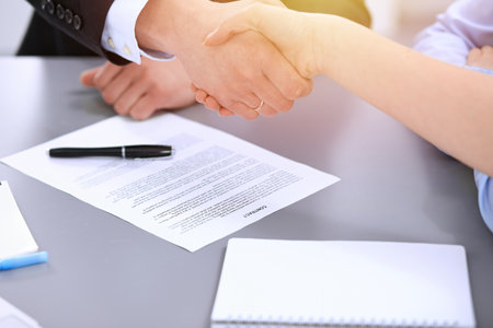 Business people shaking hands, finishing up a meetingの写真素材
