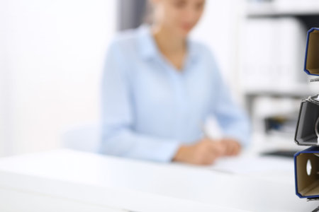 Binders with papers are waiting to be processed by business woman or bookkeeper back in blur. Internal Audit and tax conceptの写真素材