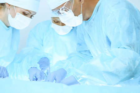 A group of surgeons is operating at the hospital. Health care conceptの写真素材