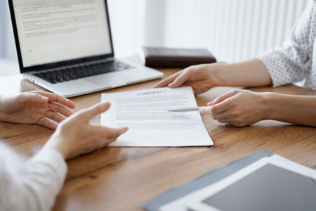 Businesswoman lawyer pointing into contract special points admitting something for colleague or...