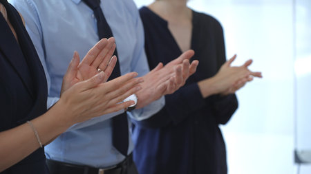 Business people are clapping hands, expressing gratitude and acknowledging a successful performance...