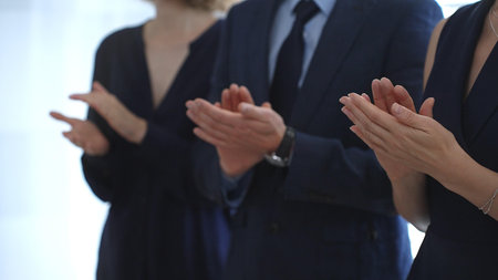 Business people are clapping hands, expressing gratitude and acknowledging a successful performance...