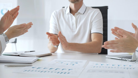 Professional business people team clapping hands, celebrating successful presentation, displaying...