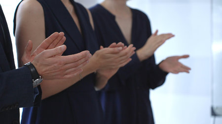 Business people hands clapping, showing applause and appreciation for success and achievement during a corporate event or conference meeting in officeの写真素材