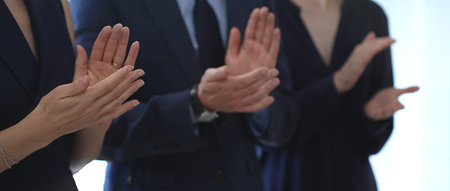 Business people are clapping hands, expressing gratitude and acknowledging a successful performance...
