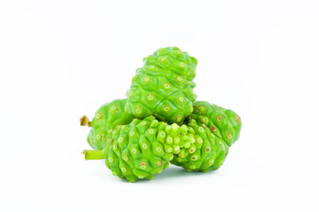 Noni fruits on white isolated background の写真素材