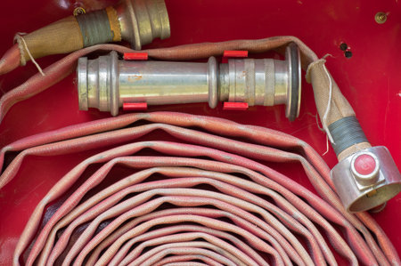 Old Red fire hose の写真素材