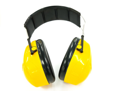 Yellow working protective headphones, it is isolated on white の写真素材