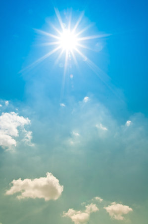 Blue sky with clouds and sun  