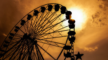 Ferris wheel processed and sunset の写真素材