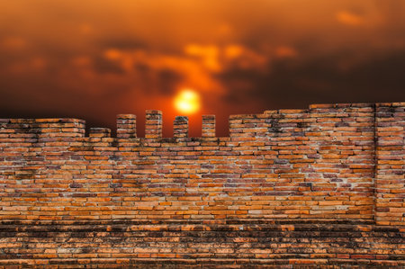 Old brick Wall and sunset backgroundの写真素材